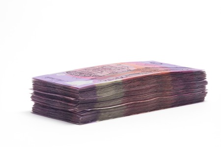 Stack of Dollar Notes on White Backgroundの写真素材