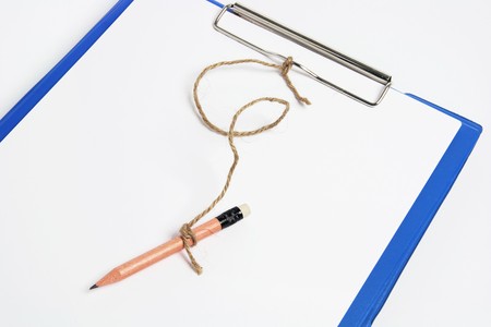 Close Up of Clipboard with Pencil の写真素材