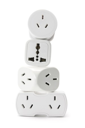 Stack of Power Adaptors on White Backgroundの写真素材