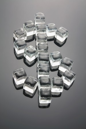 Dollar Sign Formed by Ice Cubes with Reflectionの写真素材