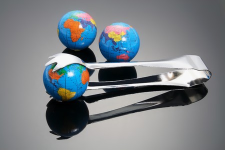 Globes and Tong with Reflectionsの写真素材