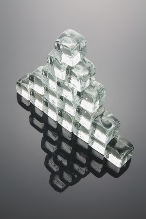 Pyramid Formed by Ice Cubes with Reflectionの写真素材