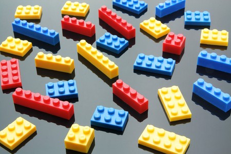 Plastic Building Blocks on Reflective Background