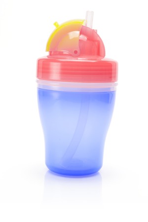 Baby Sucking Cup on White Backgroundの写真素材