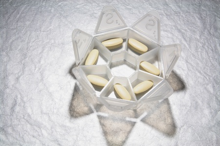 Pill Box on Seamless Grey Background