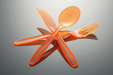Plastic Cutlery on Seamless Grey Background