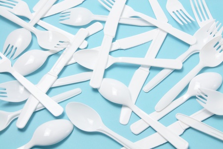 Forks, Spoons and Knives on Blue Backgroundの写真素材