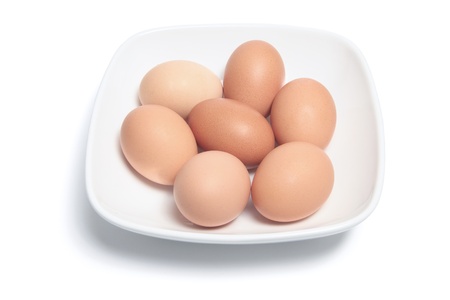Eggs and Plate on White Background