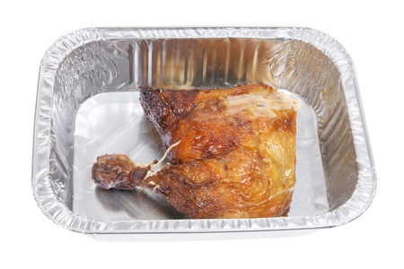 Roast Chicken in Foil Tray with White backgroundの写真素材