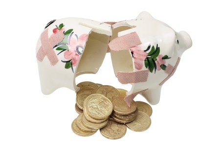 Broken Piggy Bank on White Backgroundの写真素材