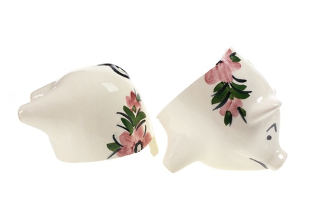 Broken Piggy Bank on White Backgroundの写真素材