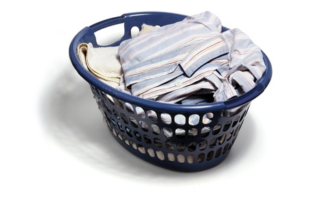 Laundry Basket with Dirty Clothes on White Backgroundの写真素材