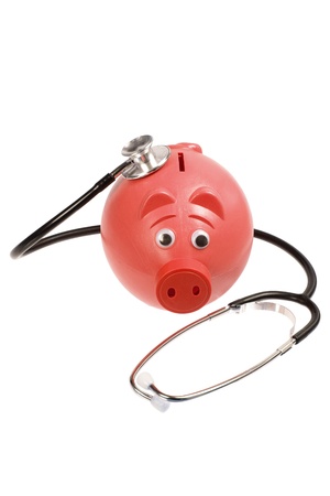 Piggy Bank and Stethoscope on White Backgroundの写真素材