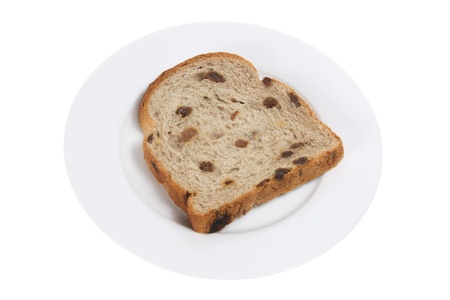 Slice of Raisin Bread on Plate with White Backgroundの写真素材