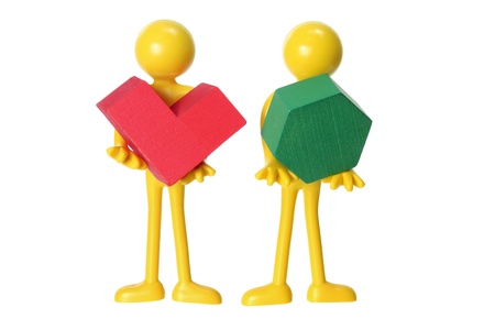 Miniature Figures with Wooden Puzzle on White Backgroundの写真素材