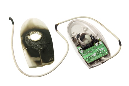 Burnt Computer Mouse on White Backgroundの写真素材