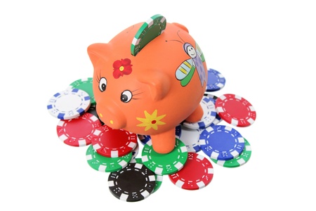 Piggybank and Poker Chips on White Backgroundの写真素材