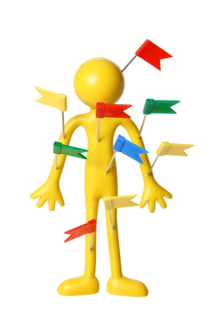 Miniature Figure with Plastic Tags on White Backgroundの写真素材