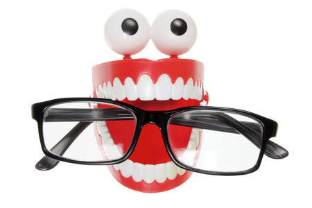 Chattering Teeth with Eyeglasses on White Background