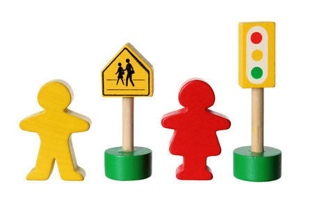 Wooden Figures with Traffic Lights on White Backgroundの写真素材
