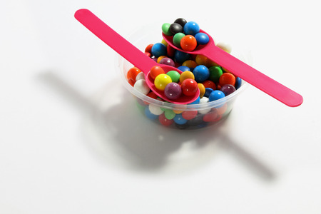 Chocolate Beans with Spoons on White Backgroundの写真素材
