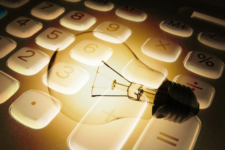 Composite of Calculator and Light Bulbの写真素材