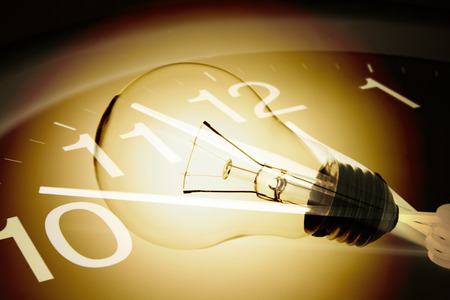 Composite of Wall Clock and Light Bulbの写真素材