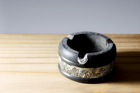 Ashtray on wooden backgroundの写真素材