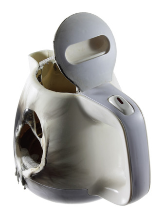 Broken Kettle on White Backgroundの写真素材