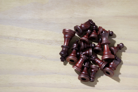 Chess Pieces on Wooden Background