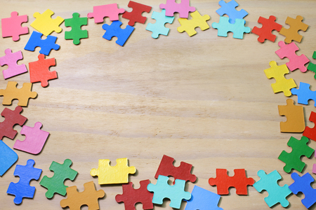 Puzzles on Wooden Backgroundの写真素材