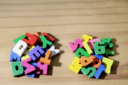 Alphabets and Numbers on Wooden Backgroundの写真素材