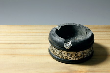 Ashtray on Wooden Backgroundの写真素材