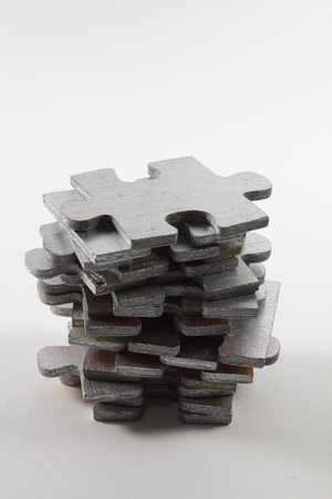 Stack of Puzzles on White Backgroundの写真素材