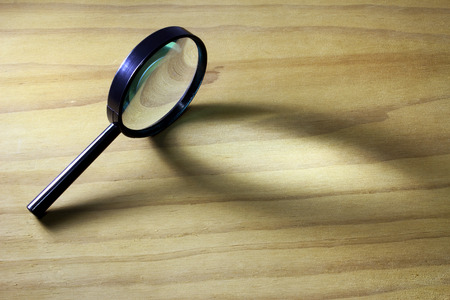 Magnifying Glass on Wooden Backgroundの写真素材