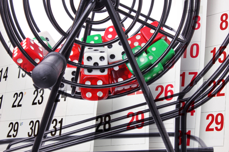 Close Up of Bingo Game Cage and Calendarの写真素材