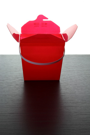 Takeaway Food Pail on Wooden Backgroundの写真素材