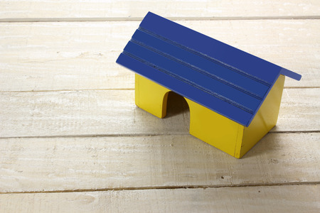 Toy House on Wooden Backgroundの写真素材