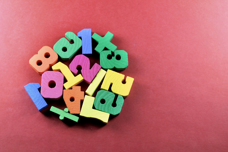 Wooden Numbers with Red Backgroundの写真素材