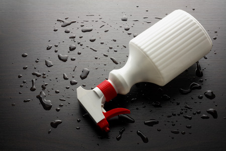 Spray Bottle on Wooden Backgroundの写真素材