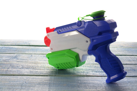 Water Pistol on Wooden Backgroundの写真素材