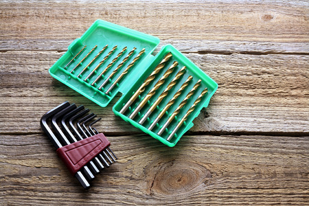 Drill Bit Se and Alllen Keys on Wooden Backgroundの写真素材