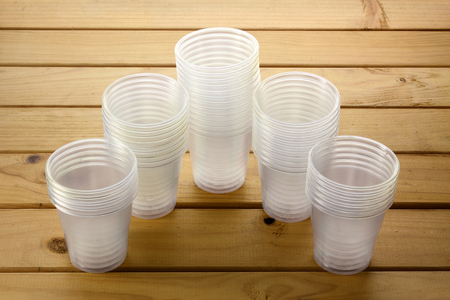 Plastic Cups on Wooden Backgroundの写真素材