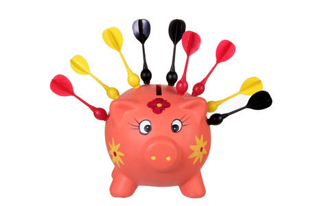 Piggybank with Darts on White Backgroundの写真素材