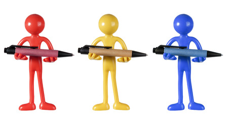 Figures Holding Pens on White Backgroundの写真素材