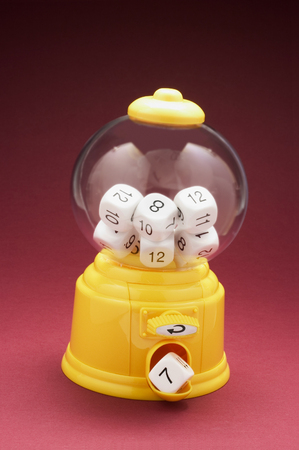 Dice in Bubblegum Machine with Red Backgroundの写真素材