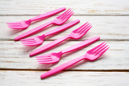 Plastic Forks on Wooden Backgroundの写真素材