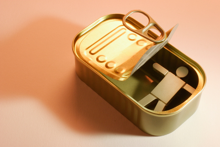 Figure in Tin Can on Warm Backgroundの写真素材
