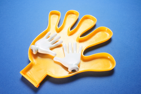 Plastic Hands on Blue Backgroundの写真素材