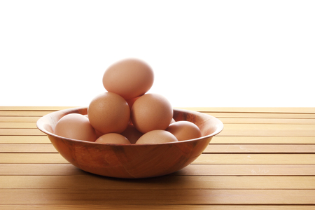 Eggs in Tray on Wooden Backgroundの写真素材